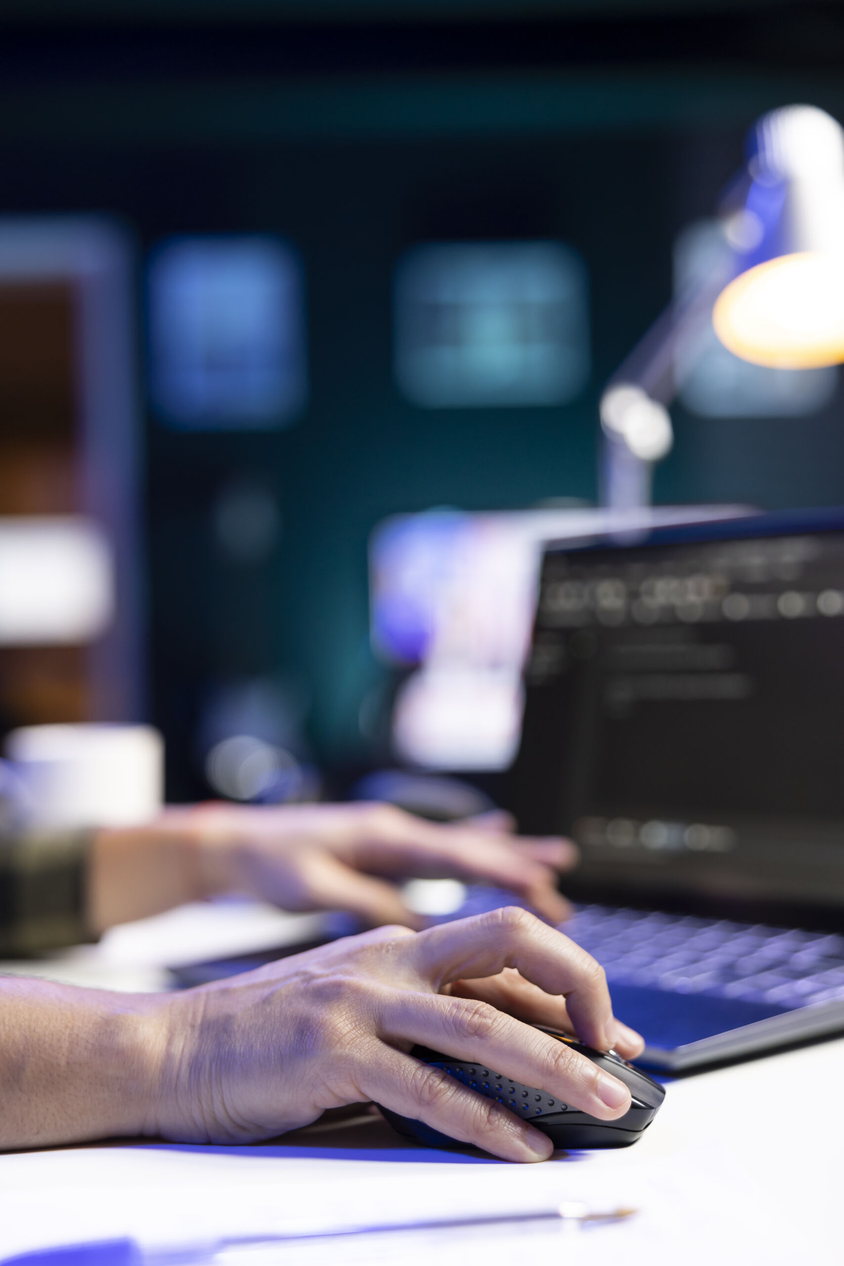 Person codes and manages system on laptop Web and System Development Agency in the UK
